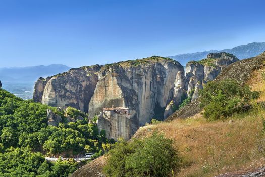 View of rocks with Monastery of Rousanou in Meteora, Greece