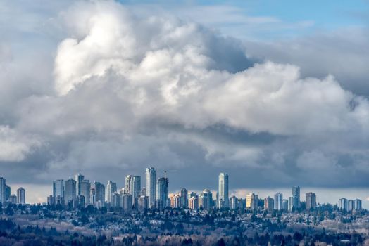 Overview of Metrotown center on stormy clouds background.