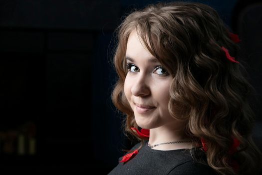 Portrait of a twenty year old girl with long hair and blue eyes. Young European.