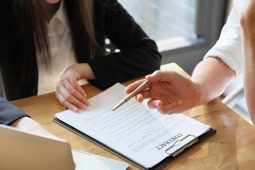 Business and lawyer discuss before sign in contract. negotiating a contract