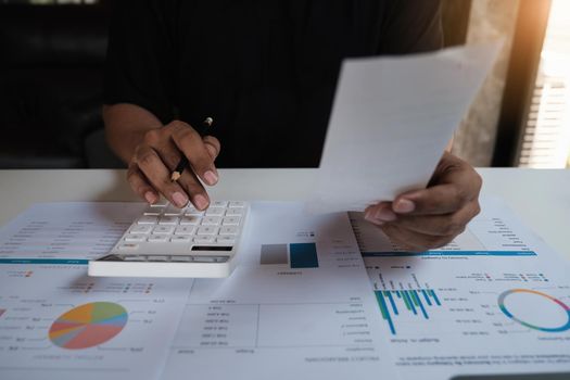 American african man is managing, calculating the debt and holding cost bill