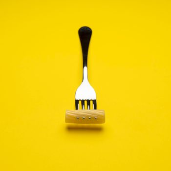 a fork with a piece of rigatoni pasta