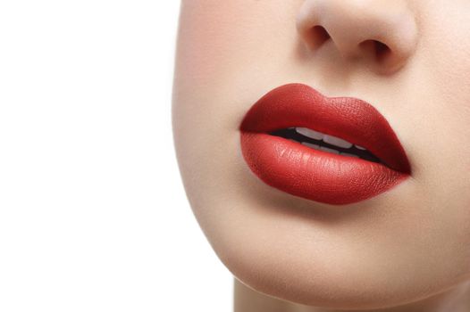 Cropped close up of full sexy sensual lips of a beautiful woman. Red lipstick on sexy plump lips isolated on white copyspace makeup visage sexuality femininity beauty face cosmetics fashion concept