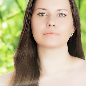 Beauty portrait of young woman for natural skincare and cosmetic brand, spring nature on background as wellness, health and organic beauty concept.