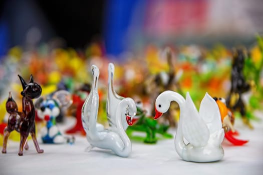 Beautiful glass figurines. Glass swans. Artificial swans.