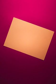 Blank A4 paper, brown on pink background as office stationery flatlay, luxury branding flat lay and brand identity design for mockup.