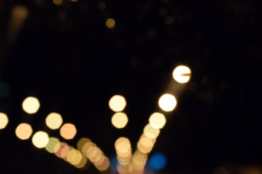 Bokeh lights of night lights on a dark background.