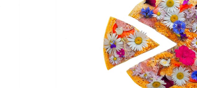 Creative pizza with a sliced slice topped with colorful flowers.