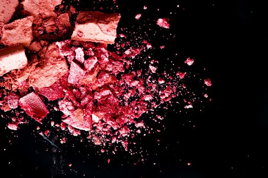 Crushed cosmetics, mineral organic eyeshadow, blush and cosmetic powder isolated on black background, makeup and beauty banner, flatlay design.