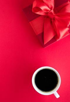 Romantic celebration, lifestyle and birthday present concept - Luxury beauty gift box and coffee on red, flatlay