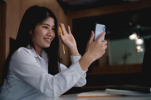 A businesswoman completes KYC using an online banking program in order to open a digital savings account. The definition of cyber security