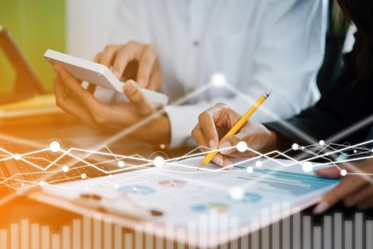 Fund managers researching and analysis Investment stock market by paperwork document with virtual financial on screen . business finance concept