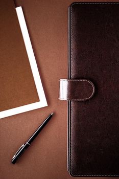 Productivity, work and corporate lifestyle concept - Vintage business briefcase on the office table desk, flatlay background