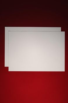 Blank A4 paper, white on red background as office stationery flatlay, luxury branding flat lay and brand identity design for mockup.