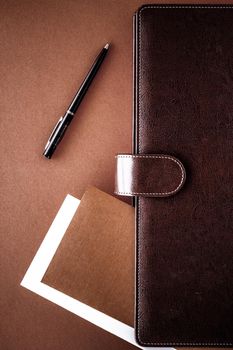 Productivity, work and corporate lifestyle concept - Vintage business briefcase on the office table desk, flatlay background