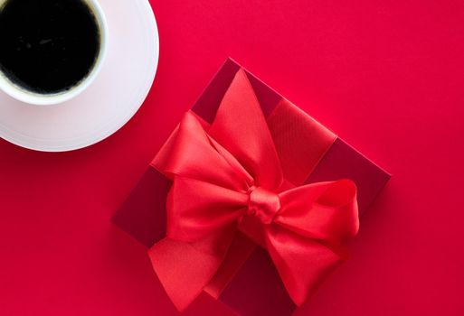 Romantic celebration, lifestyle and birthday present concept - Luxury beauty gift box and coffee on red, flatlay