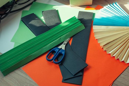 sheets of colored paper, scissors, blanks for origami. blanks for paper fan. Template for design, advertisement or text.