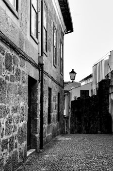Beautiful streets and old stone facades of the portuguese medieval village of Guimaraes at Christmas