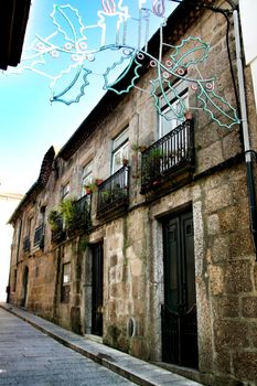 Beautiful streets and old stone facades of the portuguese medieval village of Guimaraes at Christmas