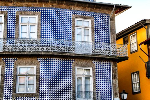 Beautiful streets and old stone facades of the portuguese medieval village of Guimaraes at Christmas
