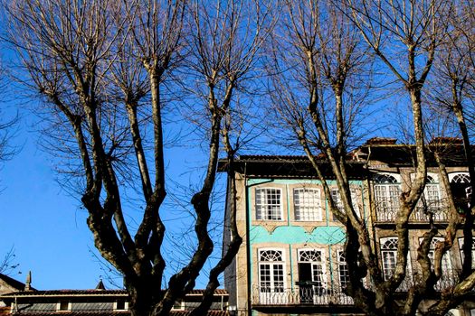 Beautiful streets and old stone facades of the portuguese medieval village of Guimaraes at Christmas