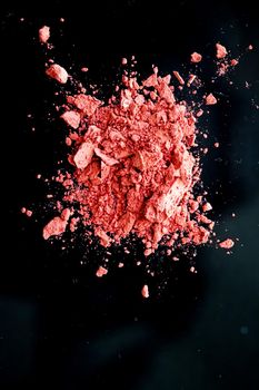 Crushed cosmetics, mineral organic eyeshadow, blush and cosmetic powder isolated on black background, makeup and beauty banner, flatlay design.