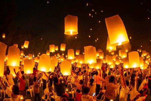 Floating lanterns on sky in Loy Krathong Festival or Yeepeng Festival , traditional Lanna Buddhist ceremony in Chiang Mai, Thailand