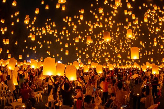 Floating lanterns on sky in Loy Krathong Festival or Yeepeng Festival , traditional Lanna Buddhist ceremony in Chiang Mai, Thailand