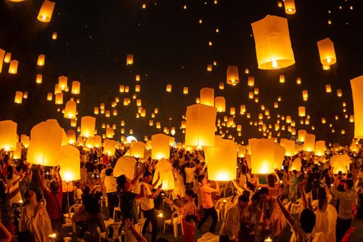 Floating lanterns on sky in Loy Krathong Festival or Yeepeng Festival , traditional Lanna Buddhist ceremony in Chiang Mai, Thailand