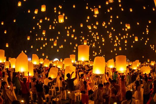 Floating lanterns on sky in Loy Krathong Festival or Yeepeng Festival , traditional Lanna Buddhist ceremony in Chiang Mai, Thailand