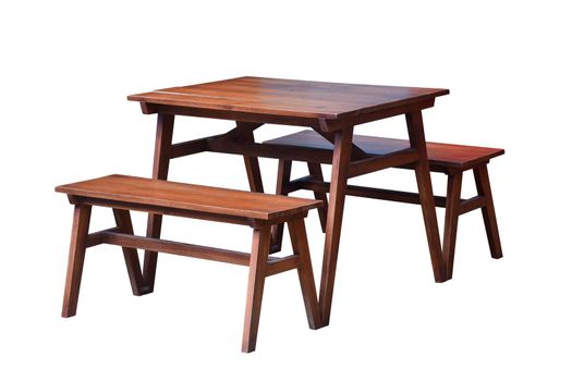 Garden table set with benches made of wood on white, Work with clipping path.