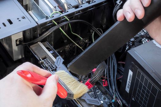 Remove dust and dirt inside the computer with a vacuum cleaner and brush.