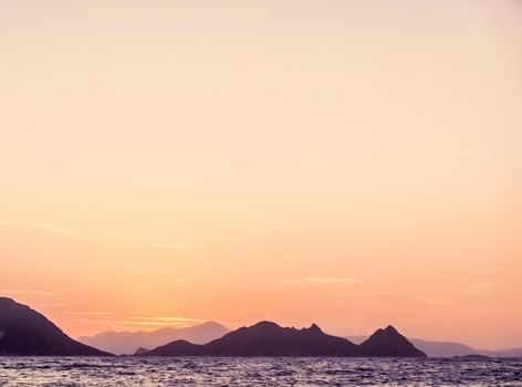 Nature, twilight and vintage beach holiday concept - Summer sunset at the Mediterranean sea coast, seascape and mountain view