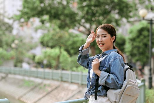 Joyful asian girl posing with soft sun light. Space for text