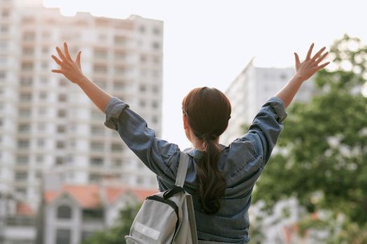 Young beautiful female traveler in the city