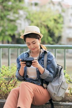 Young girl with a camera outdoors