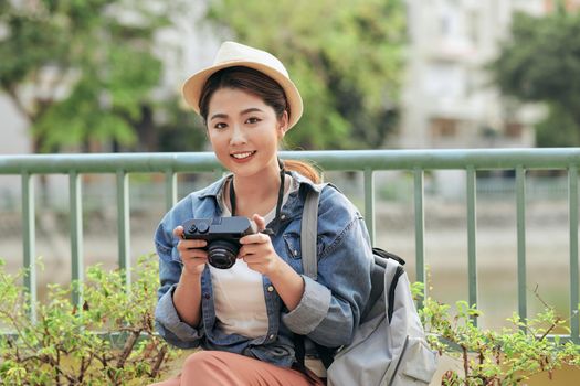 Photo of young tourist girl exploring streets.