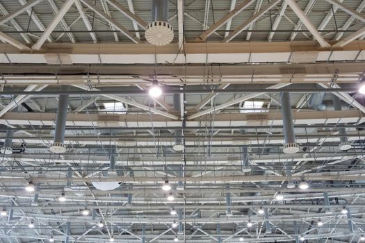 Pavilion ceiling with lights on, inside the exhibition center