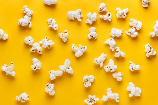 Popcorn on a yellow background. Horizontal image. Top view.
