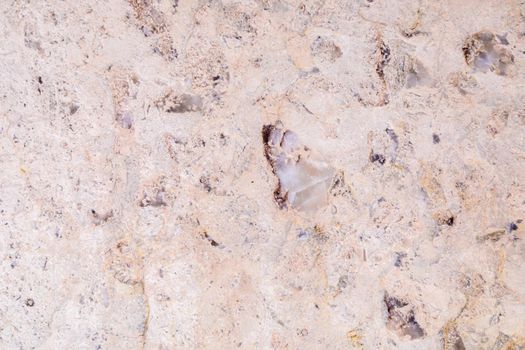 Dolomite natural stone texture. Stone with beige pattern on a smooth surface. Finishing building material.