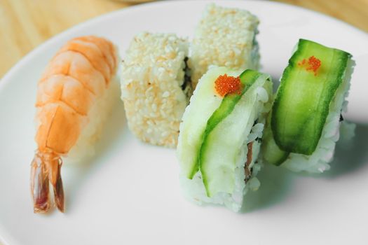 Japanese kitchen. Set of Japanese sushi and rolls. Food sticks.