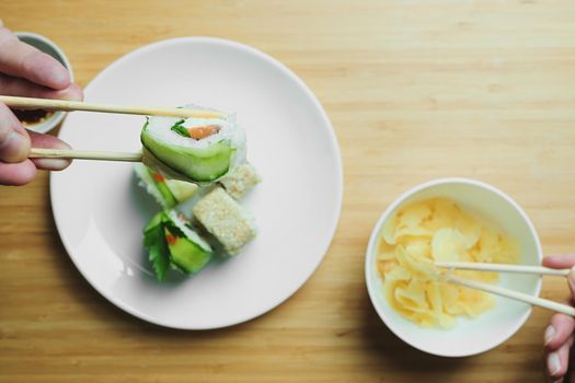 Japanese kitchen. Set of Japanese sushi and rolls. Food sticks.