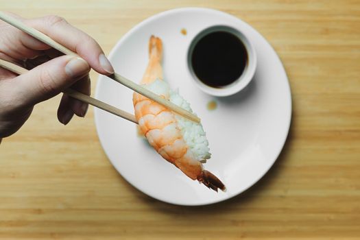 Japanese kitchen. Set of Japanese sushi and rolls. Food sticks.