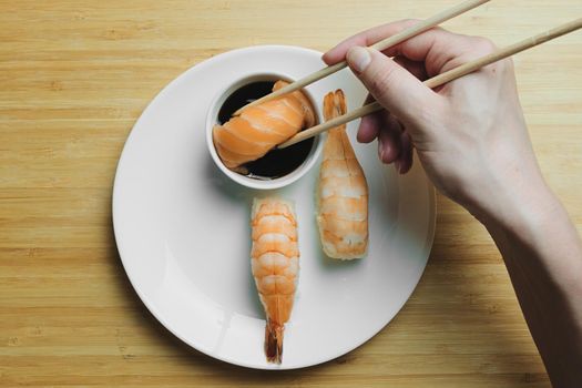 Japanese kitchen. Set of Japanese sushi and rolls. Food sticks.