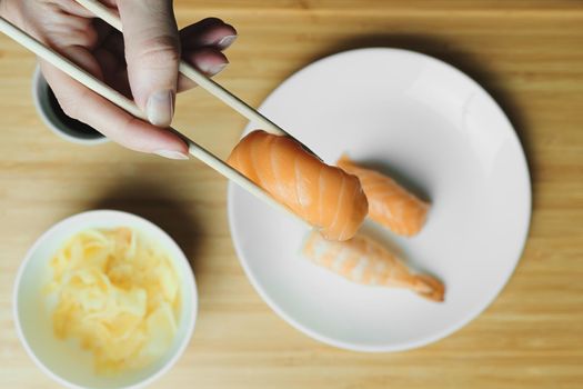 Japanese kitchen. Set of Japanese sushi and rolls. Food sticks.