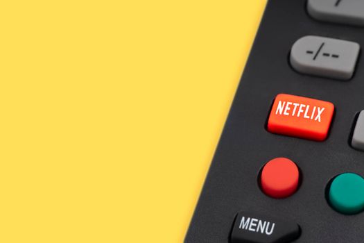 Kuala Lumpur, Malaysia : May 1, 2021 : NETFLIX television remote controller on yellow background