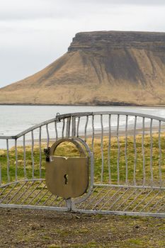 Gate with padlock on Olavsvik, a typical Icelandic town in the Snaefellsnes peninsula