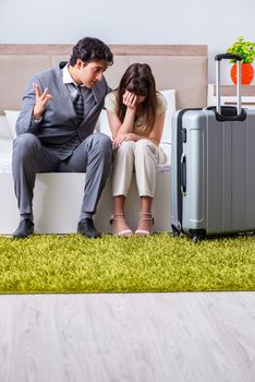 Wife seeing her husband off to business trip