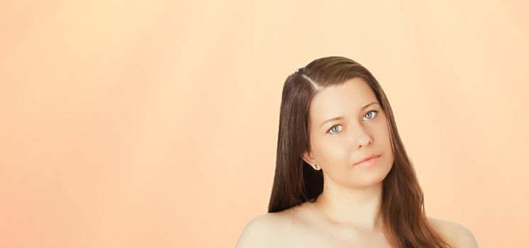 Sunny face portrait of young woman, suntan skin tone and beauty cosmetics. Beautiful brunette female model with natural tan using sunscreen product.