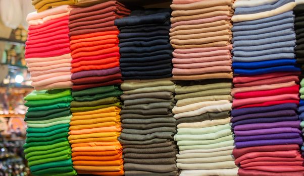 Pile of bright Multi-colored pieces of fabric in a bazaar